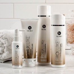 Image of the ProLuxe Hair Care System, including Scalp Treatment, Hair Mask, Conditioner and Shampoo, in a bathroom setting.